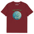 A burgundy organic graphic t-shirt featuring the Sacred Planet iteration of the Reach Of The Spirit Celtic knot design under a message reading "Happy Earth Day".