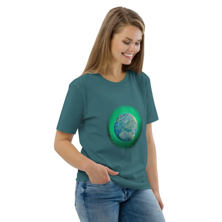 A young woman wearing a stargazer Xigfireon graphic organic cotton t-shirt featuring the Deep Forest iteration of the Reach Of The Spirit Celtic knot design. The Reach Of The Spirit Celtic knot represents the glorious Earth.