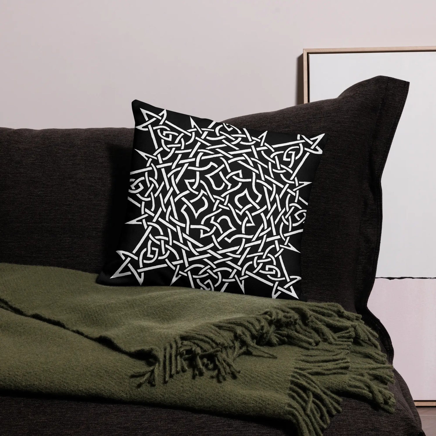 The front side of an 18 inch by 18 inch Xigfireon pillowcase featuring the Black & White Súmáilte iteration of the Morning Star Fire Celtic knot design, representing the Sun.