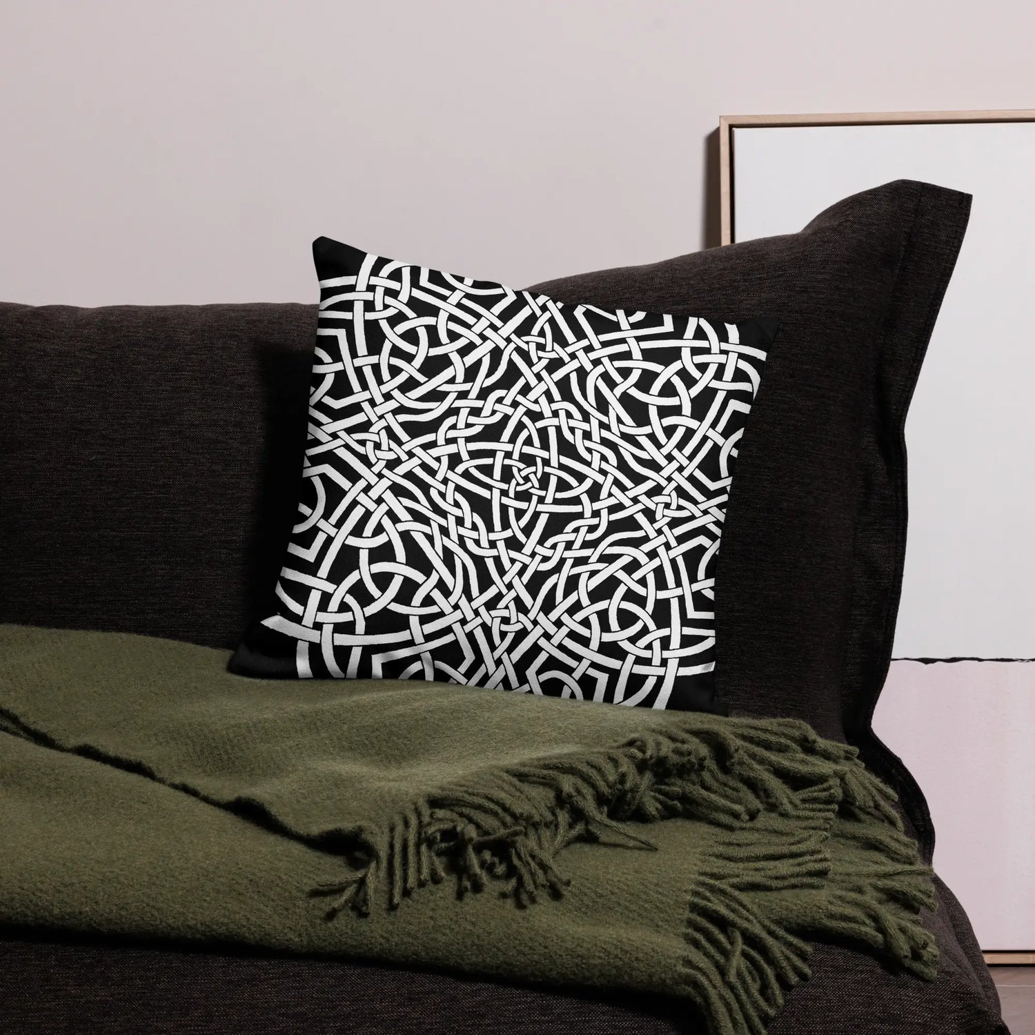 The front side of an 18 inch by 18 inch Xigfireon pillowcase featuring the Black & White Súmáilte iteration of the Reach Of The Spirit Celtic knot design. The Reach Of The Spirit Celtic knot represents Mother Earth.