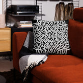 The front side of a 22 inch by 22 inch Xigfireon pillowcase featuring the Black & White Súmáilte iteration of the Reach Of The Spirit Celtic knot design. The Reach Of The Spirit Celtic knot represents Mother Earth.
