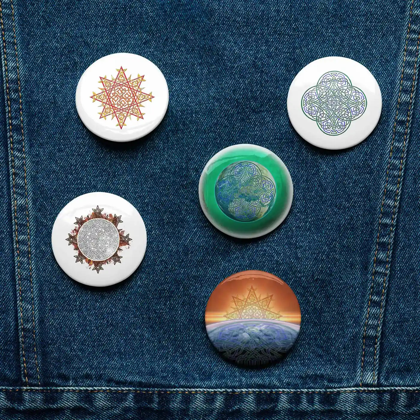 A jean jacket with 5 assorted 2.25 inch pin-back buttons featuring Morning Star Fire, Reach Of The Spirit, and Derivation II Celtic knot designs.