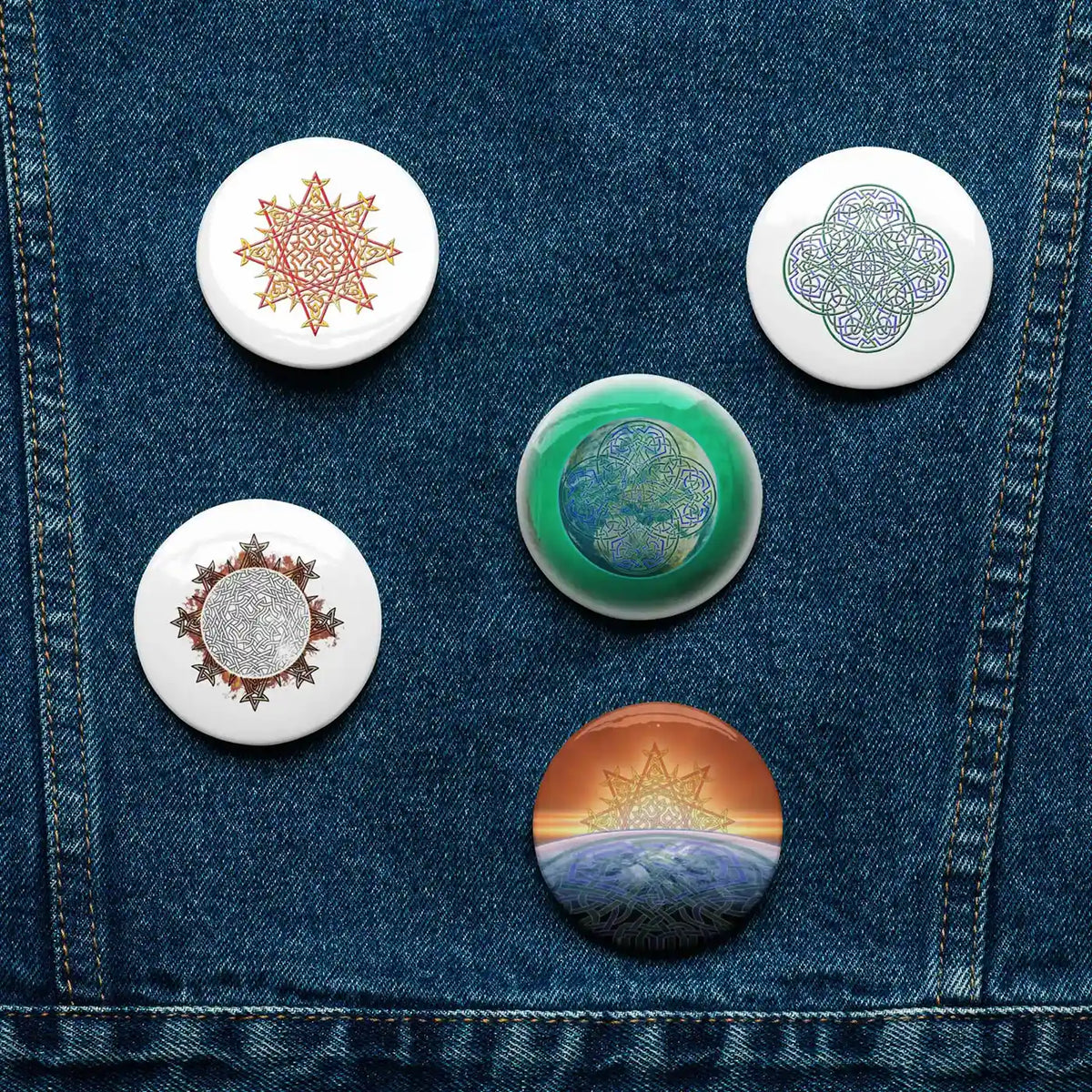 A jean jacket with 5 assorted 2.25 inch pin-back buttons featuring Morning Star Fire, Reach Of The Spirit, and Derivation II Celtic knot designs.