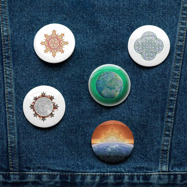 A jean jacket with 5 assorted 2.25 inch pin-back buttons featuring Morning Star Fire, Reach Of The Spirit, and Derivation II Celtic knot designs.