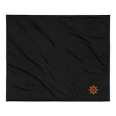 A black Xigfireon sherpa blanket embroidered with the Fire Colour iteration of the Morning Star Fire Celtic knot design.