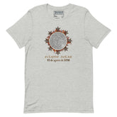 A light heather gray t-shirt by Xigfireon featuring a circular Celtic knot eclipse graphic with the Spanish text &
