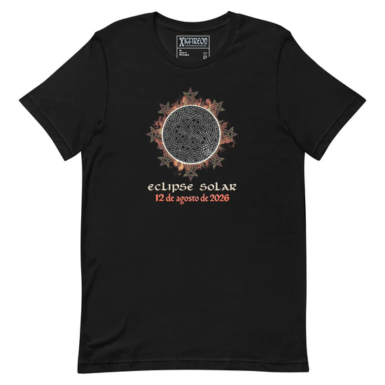 A black short-sleeve t-shirt with a graphic of a solar eclipse by Xigfireon. The graphic features a detailed Sun design with red and orange leaf-like accents, followed by the Spanish text &