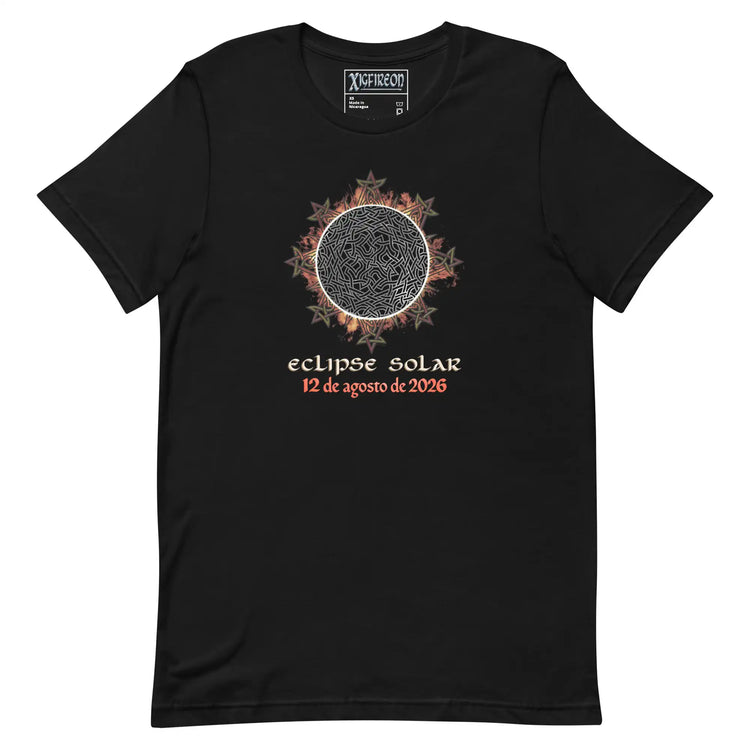 A black short-sleeve t-shirt with a graphic of a solar eclipse by Xigfireon. The graphic features a detailed Sun design with red and orange leaf-like accents, followed by the Spanish text &