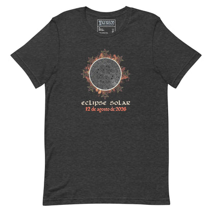 A dark heather gray t-shirt by Xigfireon featuring a graphic of a solar eclipse with orange and red leaf accents, and  Spanish text reading &