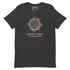 A dark heather gray t-shirt by Xigfireon featuring a graphic of a solar eclipse with orange and red leaf accents, and  Spanish text reading &