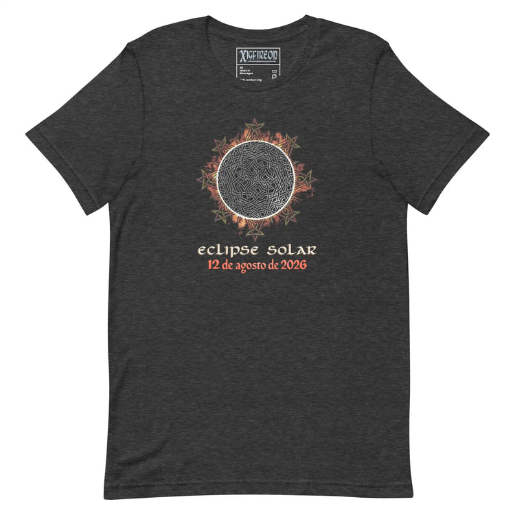 A dark heather gray t-shirt by Xigfireon featuring a graphic of a solar eclipse with orange and red leaf accents, and  Spanish text reading &