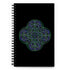 The front side of a Xigfireon spiral notebook featuring the Living Colour iteration of the Reach Of The Spirit Celtic knot design.