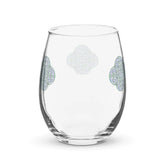 The back side of a stemless wine glass featuring the Living Colour iteration of the Reach Of The Spirit Celtic knot design.