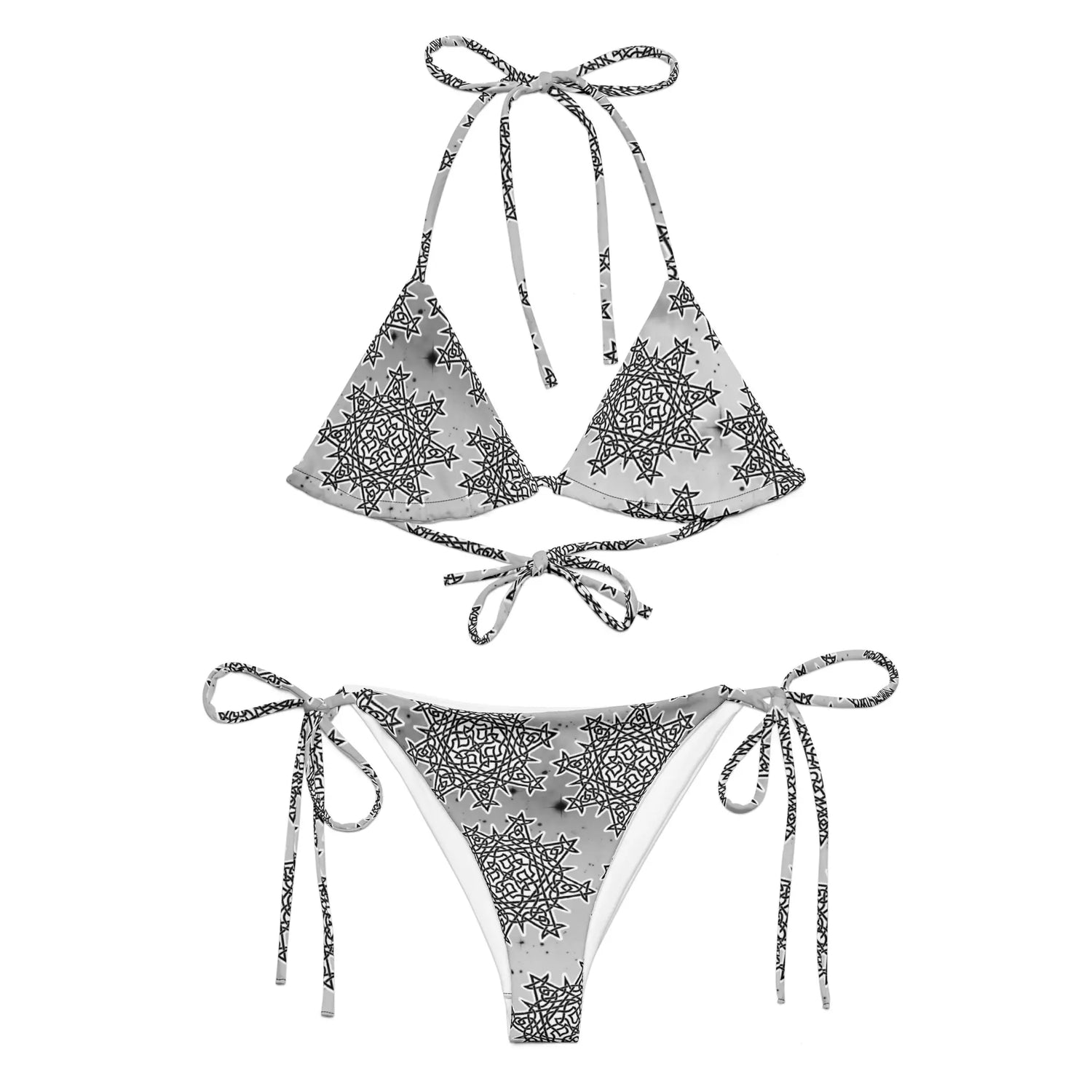 A view of the outside of a string bikini featuring the Inverted Black & White Solid Cosmos iteration of the Morning Star Fire Celtic knot pattern.