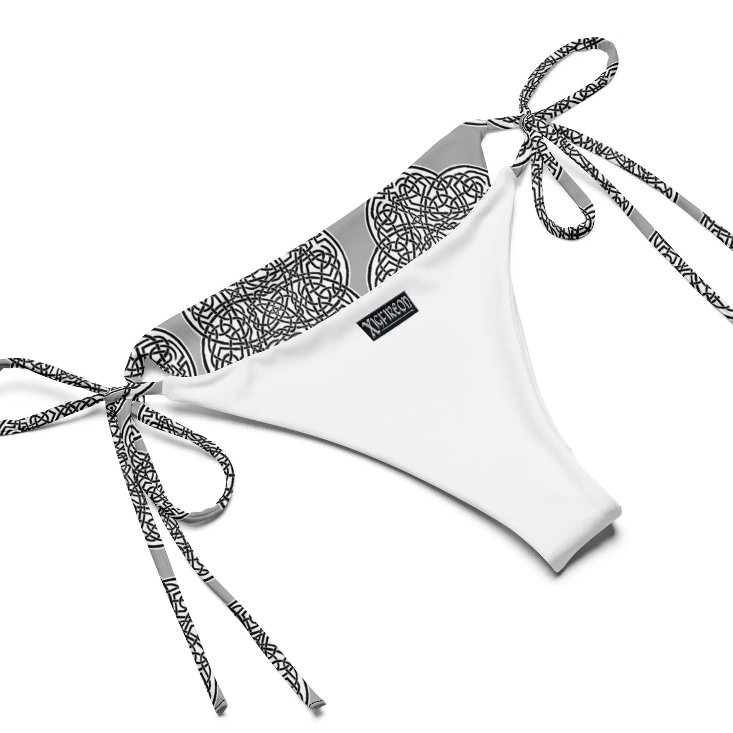 A view of the inside of the string bikini bottom featuring the Inverted Black & White Solid iteration of the Reach Of The Spirit Celtic knot pattern.