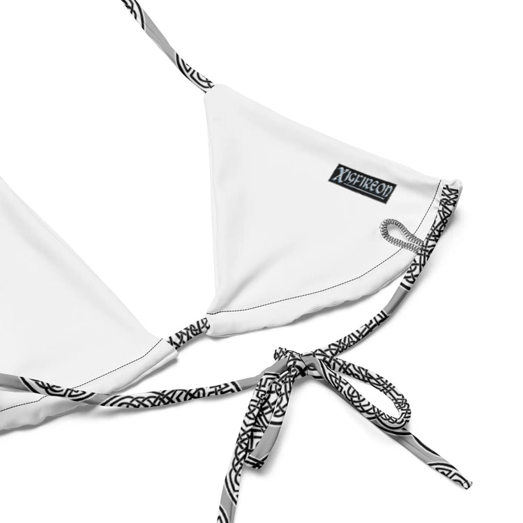 A view of the inside of a string bikini top featuring the Inverted Black & White Solid iteration of the Reach Of The Spirit Celtic knot pattern.