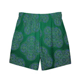 The back side of a pair of Xigfireon graphic swim trunks featuring the Living Colour Forest patterned series of the Reach Of The Spirit Celtic knot design.