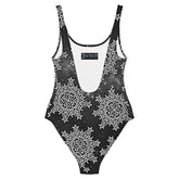 The back side of a Xigfireon graphic swimsuit featuring the Black & White Solid Cosmos patterned series of the Morning Star Fire Celtic knot design.