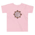 A pink Xigfireon toddler graphic t-shirt featuring the Eclipsed iteration of the Morning Star Fire Celtic knot design. The Morning Star Fire Celtic knot represents the Sun.