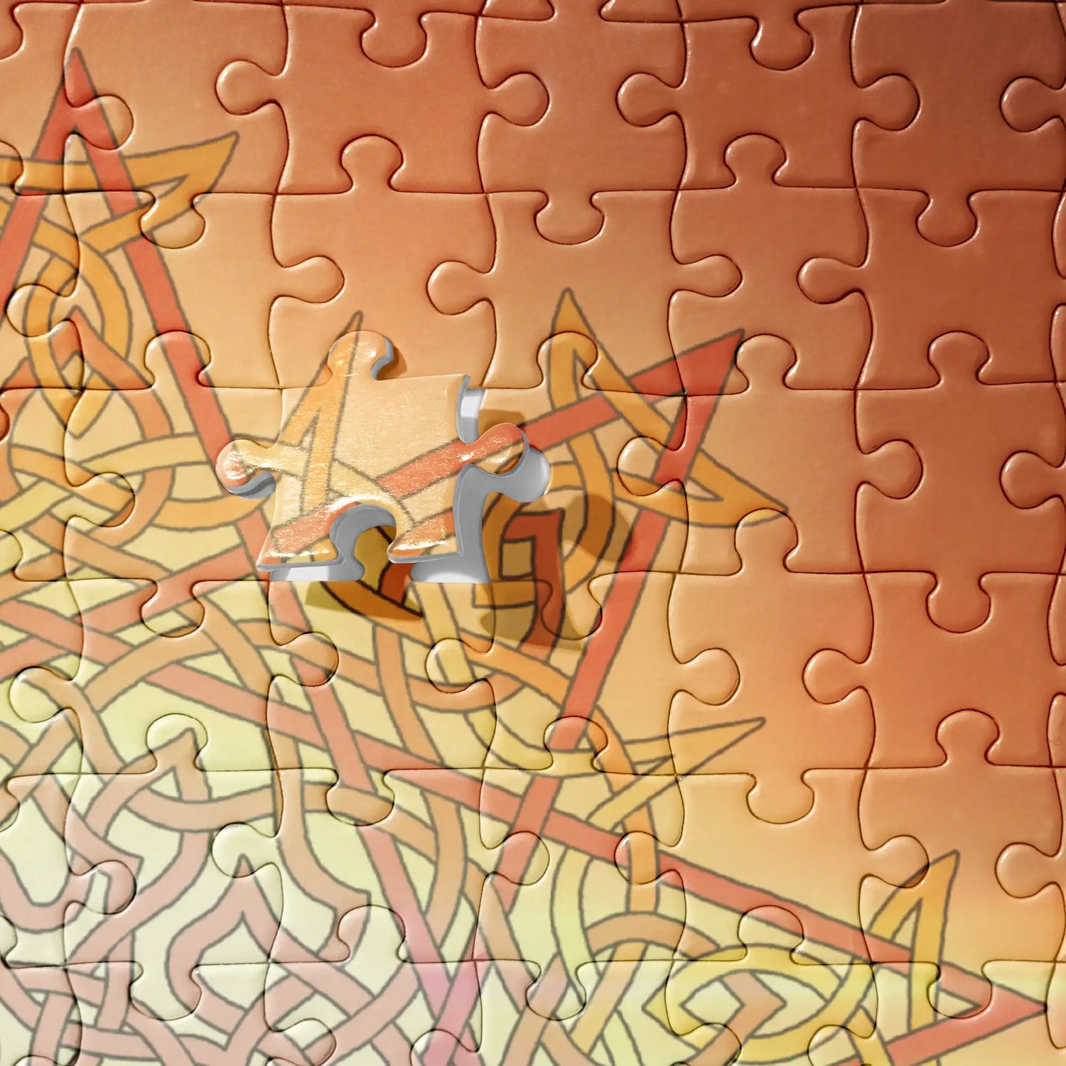A close-up view of a 520 piece jigsaw puzzle featuring the Derivation II Celtic knot merger design, which symbolizes the Sun and the Earth and their cosmic dance.