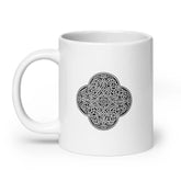 A Xigfireon white glossy 20oz mug featuring the Black & White Solid iteration of the Reach Of The Spirit Celtic knot design. This Celtic knot represents the Earth.