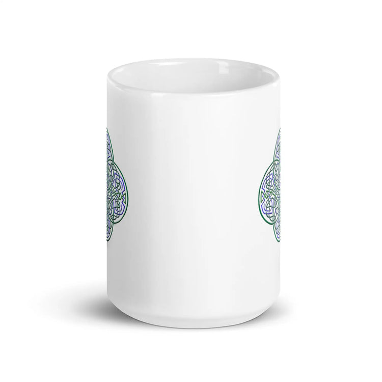 The front side of a Xigfireon white ceramic 15oz mug featuring the Living Colour iteration of the Reach Of The Spirit Celtic knot design. This Celtic knot symbolizes Mother Earth.