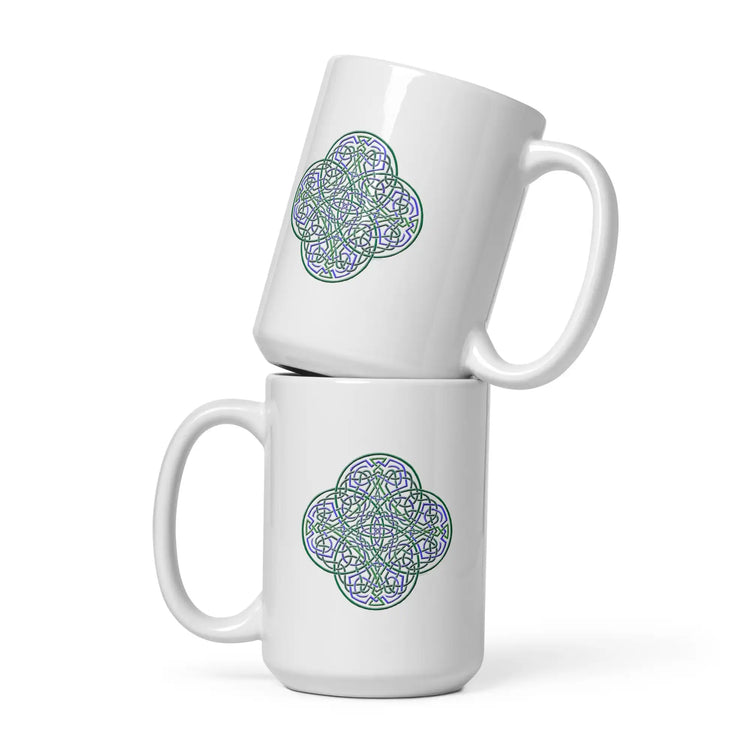 A stack of two Xigfireon white ceramic 15oz mugs featuring the Living Colour iteration of the Reach Of The Spirit Celtic knot design. This Celtic knot symbolizes Mother Earth.