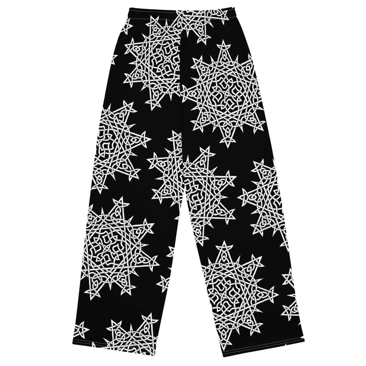 The back side of a pair of Xigfireon graphic wide leg pants featuring the Black and White Solid patterned series of the Morning Star Fire Celtic knot design.