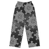 The front side of a pair of Xigfireon graphic wide leg pants featuring the Black and White Solid Cosmos patterned series of the Morning Star Fire Celtic knot design.