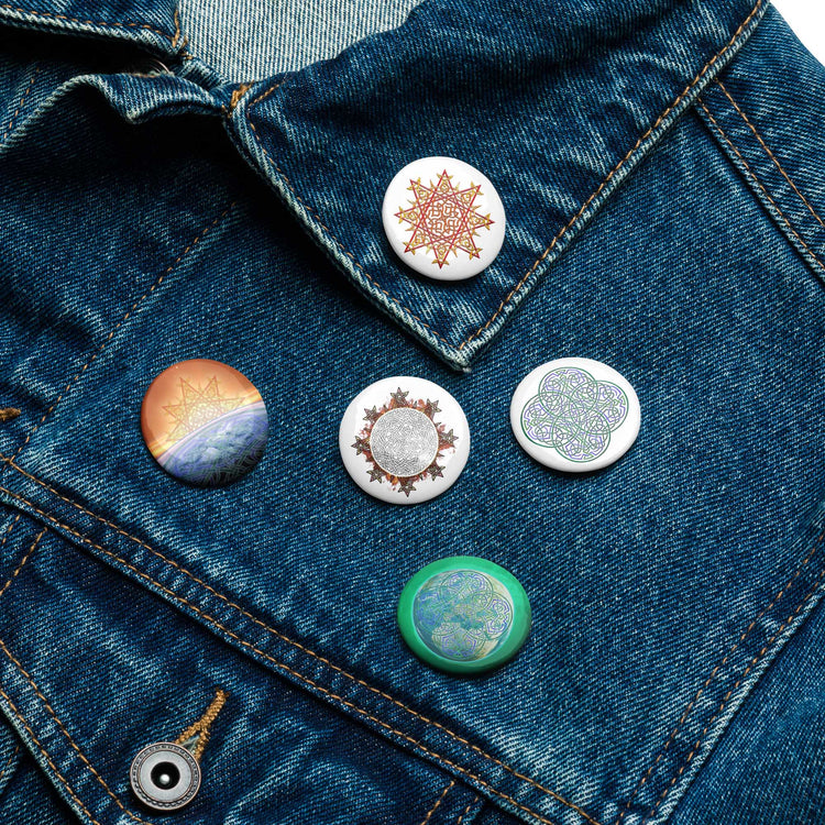 A jean jacket with 5 assorted 1.25 inch pin-back buttons featuring `Morning Star Fire`, `Reach Of The Spirit`, and `Derivation II` Celtic knot designs.