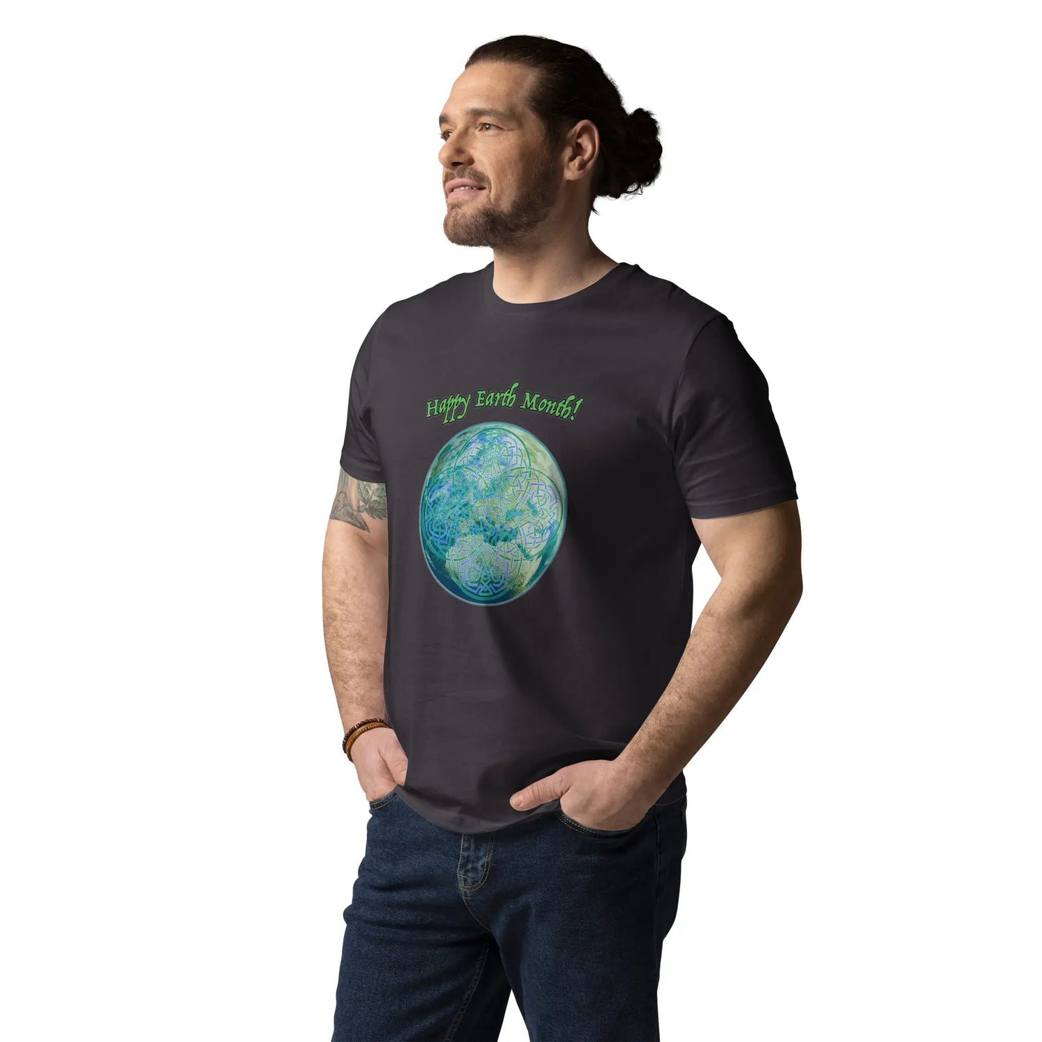 A young man wearing an anthracite organic graphic t-shirt featuring the Sacred Planet iteration of the `Reach Of The Spirit` Celtic knot design under a message reading "Happy Earth Month".