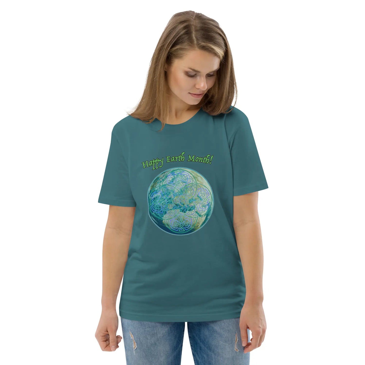 A young woman wearing a stargazer organic graphic t-shirt featuring the Sacred Planet iteration of the `Reach Of The Spirit` Celtic knot design under a message reading "Happy Earth Month".