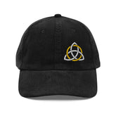 The front side of a black Xigfireon vintage corduroy cap embroidered with a White & Gold Celtic Trinity Knot, offset to the left.
