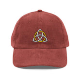 The front side of a burgundy Xigfireon vintage corduroy cap embroidered with a White & Gold Celtic Trinity Knot