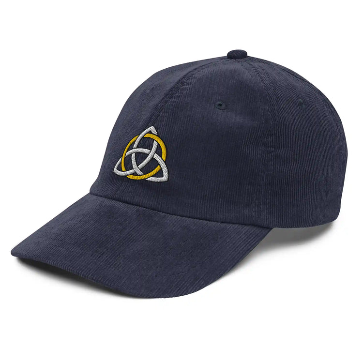 A view of the front left side of a navy blue Xigfireon vintage corduroy cap embroidered with a White & Gold Celtic Trinity Knot.
