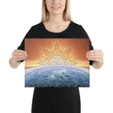 A young woman holding a 12 inch x 16 inch canvas print of the `Derivation II` Celtic knot design, which symbolizes the Sun and the Earth and their cosmic dance.