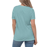 A young woman, viewed from behind, wearing a heather blue lagoon Xigfireon woman&