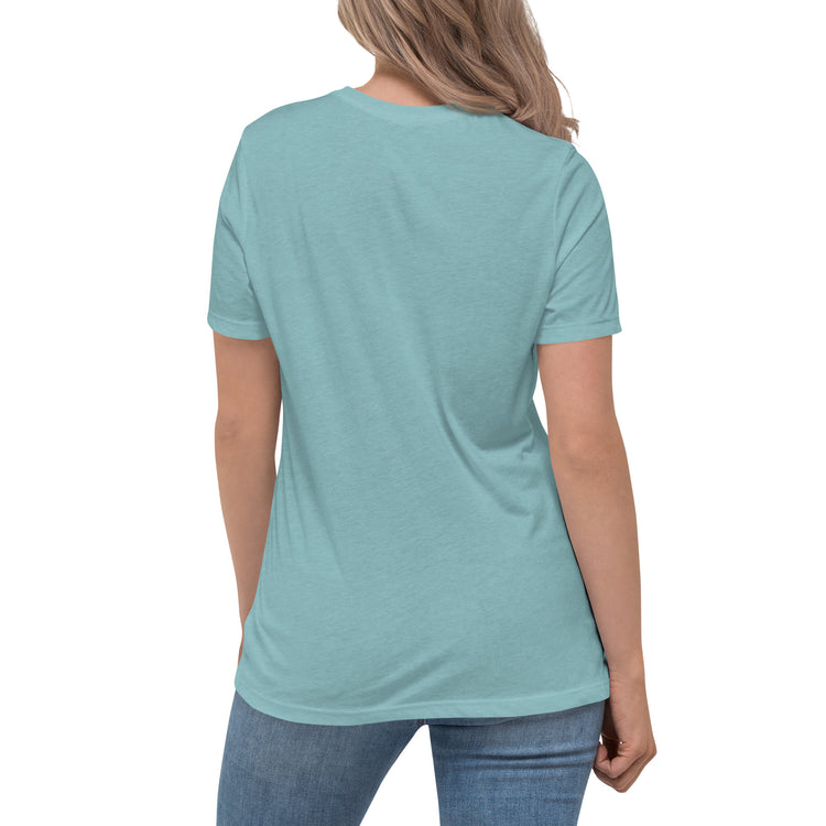 A young woman, viewed from behind, wearing a heather blue lagoon Xigfireon woman&