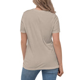 A young woman, viewed from behind, wearing a heather stone Xigfireon woman&