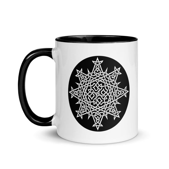 A Xigfireon white ceramic 11oz mug featuring the Black & White Circle iteration of the `Morning Star Fire` Celtic knot design, with black handle and inside. This Celtic knot symbolizes Father Sun.