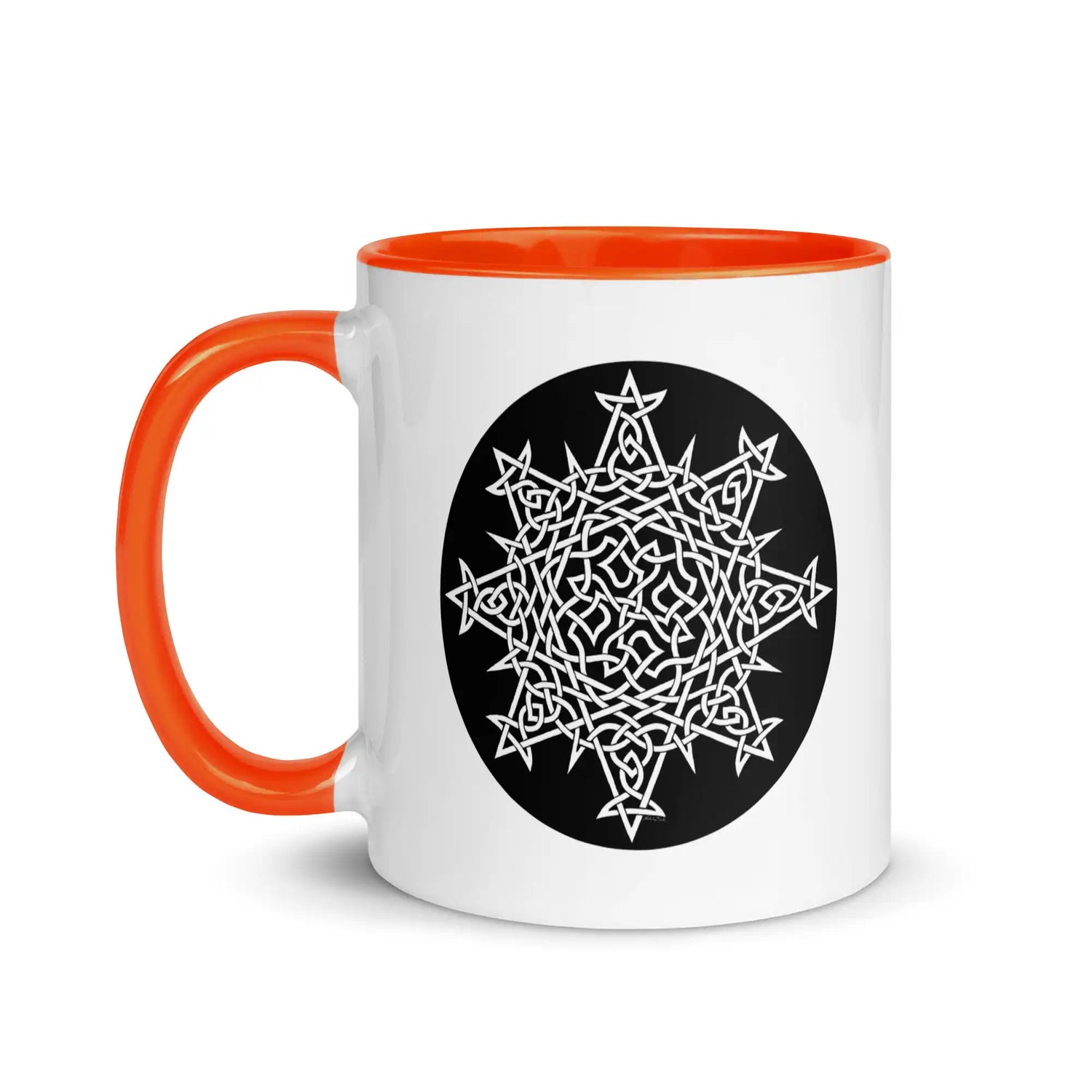 A Xigfireon white ceramic 11oz mug featuring the Black & White Circle iteration of the `Morning Star Fire` Celtic knot design, with orange handle and inside. This Celtic knot symbolizes Father Sun.