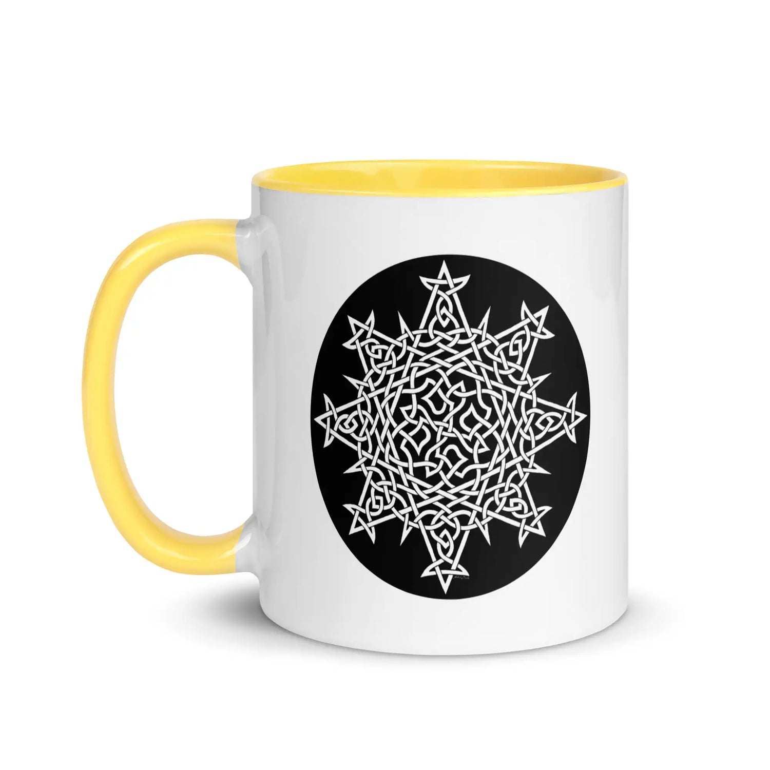 A Xigfireon white ceramic 11oz mug featuring the Black & White Circle iteration of the `Morning Star Fire` Celtic knot design, with yellow handle and inside. This Celtic knot symbolizes Father Sun.
