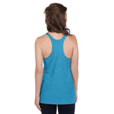 A young woman, viewed from behind, wearing a vintage turquoise Xigfireon graphic women&