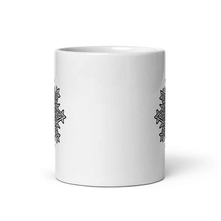 The front side of a Xigfireon white glossy 11oz mug featuring the Black & White Solid iteration of the `Morning Star Fire` Celtic knot design. This Celtic knot symbolizes Father Sun.