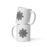 A stack of two Xigfireon white glossy 11oz mugs featuring the Black & White Solid iteration of the `Morning Star Fire` Celtic knot design. This Celtic knot symbolizes Father Sun.