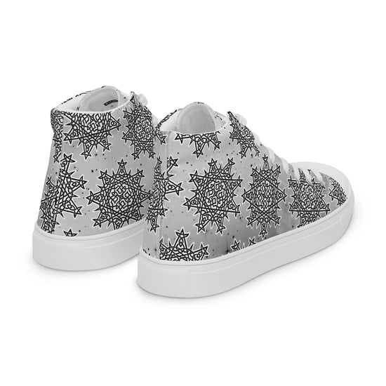 A view of the back of a pair of canvas high tops featuring the Inverted Black & White Solid Cosmos iteration of the `Morning Star Fire` Celtic knot pattern.