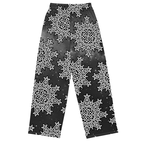 The back side of a pair of Xigfireon graphic wide leg pants featuring the Black and White Solid Cosmos patterned series of the `Morning Star Fire` Celtic knot design.