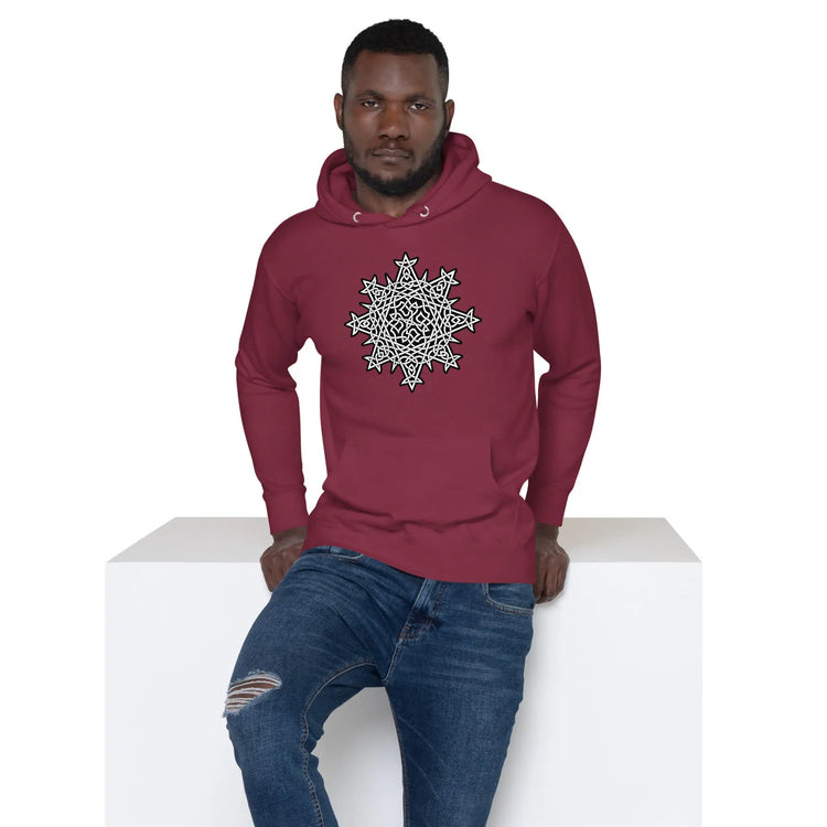 A young man wearing a maroon Xigfireon graphic hoodie featuring the Black & White Solid iteration of the `Morning Star Fire` Celtic knot design. The `Morning Star Fire` Celtic knot represents the Sun.