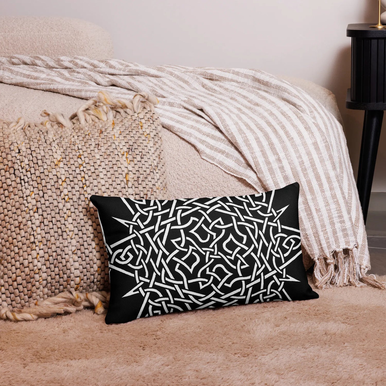 The front side of a 20 inch by 12 inch Xigfireon pillowcase featuring the Black & White Súmáilte iteration of the `Morning Star Fire` Celtic knot design, symbolizing Father Sun.