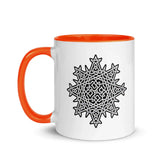 A Xigfireon white ceramic 11oz mug featuring the Black & White Solid iteration of the `Morning Star Fire` Celtic knot design, with orange handle and inside. This Celtic knot symbolizes Father Sun.